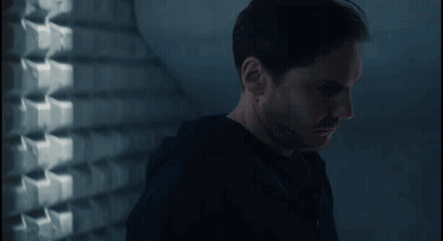Man In Black Shirt In Dark Room GIF
