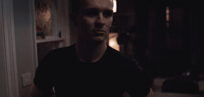 Man In Black Shirt In Darkness GIF