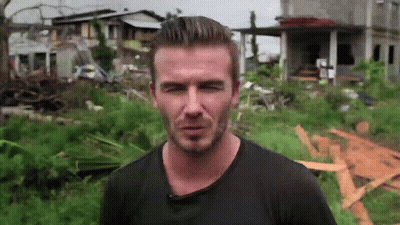 Man In Black Shirt In Field With House GIF