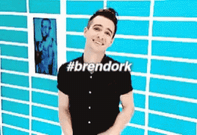 Man In Black Shirt In Front Of Blue Brick Wall #Brendork GIF
