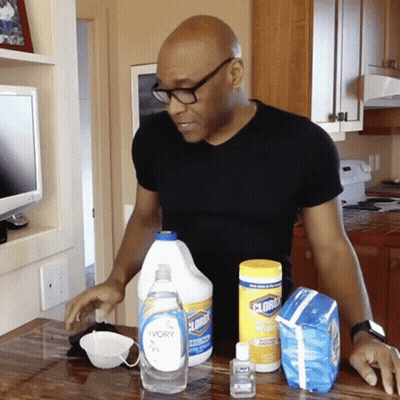 Man In Black Shirt In Front Of Clorox Bottle GIF