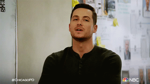 Man In Black Shirt In Front Of Sticky Note Wall With Chicagopd GIF