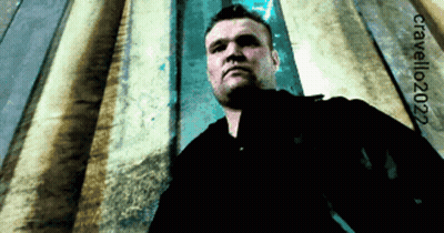 Man In Black Shirt In Front Of Wall With 2022 GIF
