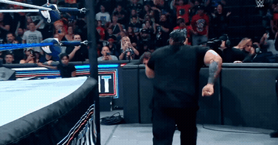 Man In Black Shirt In Wrestling Ring With Sign Saying It GIF