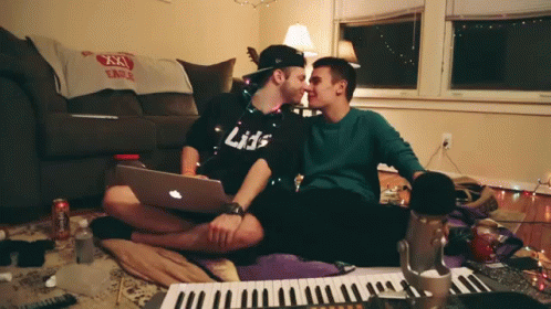 Man In Black Shirt Kissing Another Man GIF