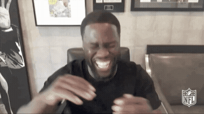 Man In Black Shirt Laughing With NFL Logo GIF
