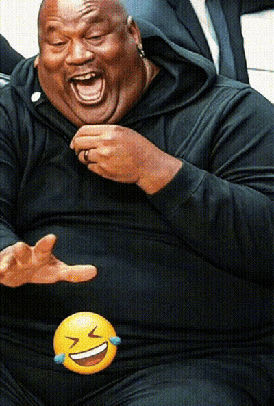 Man In Black Shirt Laughing With Yellow Smiley Face GIF