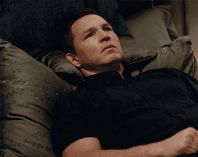 Man In Black Shirt Laying On Bed GIF