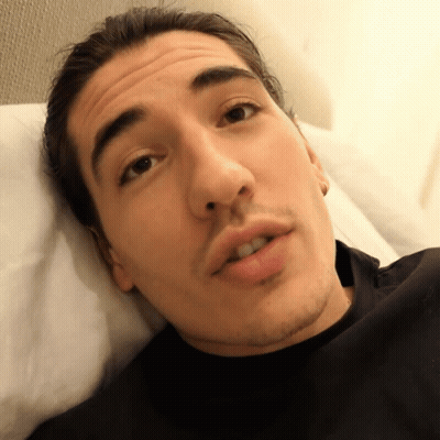 Man In Black Shirt Laying On Bed GIF