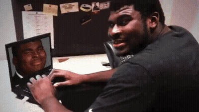 Man In Black Shirt Looking At Laptop With Man Photo GIF