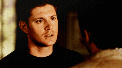 Man In Black Shirt Looking At Man In White Shirt GIF