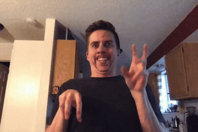 Man In Black Shirt Making Face With Hands GIF