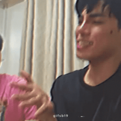 Man In Black Shirt Making Funny Face Beside Man In Pink Shirt GIF