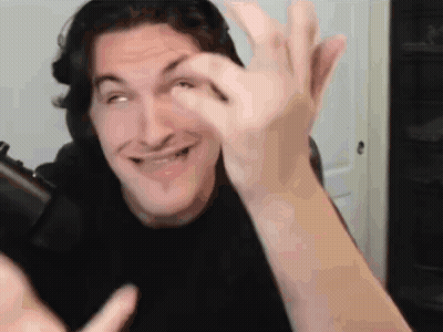 Man In Black Shirt Making Funny Face Holding Cell Phone GIF
