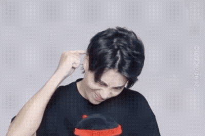Man In Black Shirt Making Funny Face Holding Hand To Ear GIF