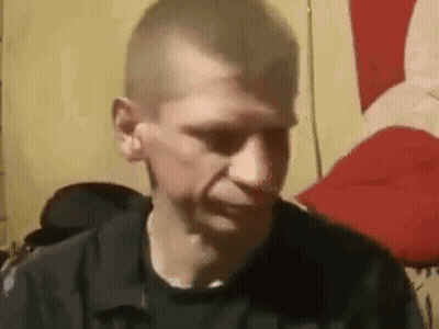 Man In Black Shirt Making Funny Face In Chair GIF