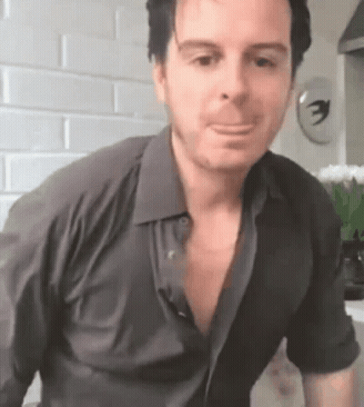 Man In Black Shirt Making Funny Face GIF