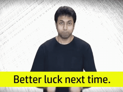 Man In Black Shirt Next To Better Luck Sign GIF