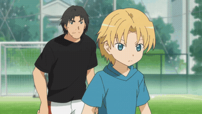 Man In Black Shirt Next To Boy With Blonde Hair GIF