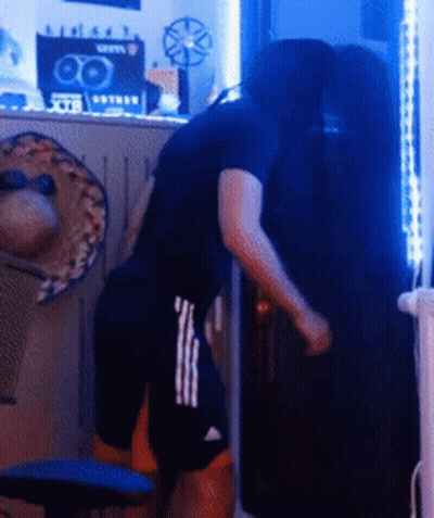 Man In Black Shirt Next To Man In Shorts GIF