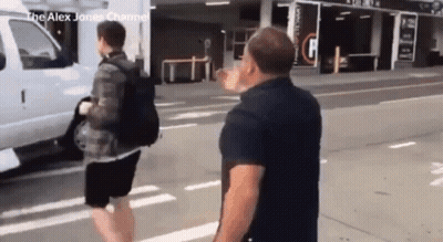 Man In Black Shirt Next To White Van GIF