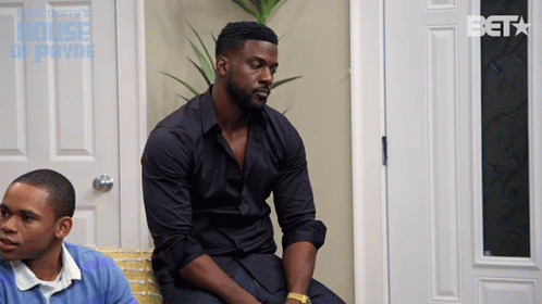 Man In Black Shirt On Couch In Front Of Beta Door GIF