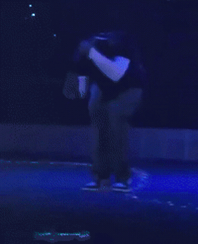 Man In Black Shirt On Stage With Blue Light GIF