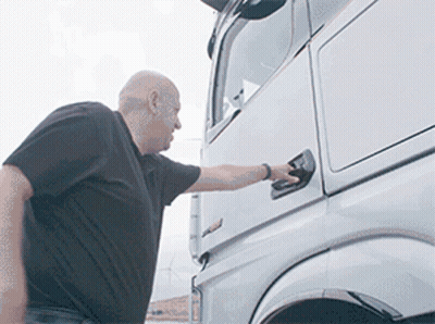 Man In Black Shirt Opening Semi Truck Door GIF
