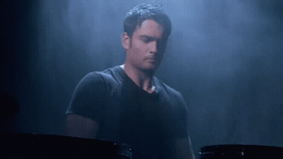 Man In Black Shirt Playing Drum Set GIF