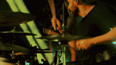 Man In Black Shirt Playing Drum Set GIF