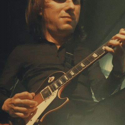 Man In Black Shirt Playing Gibson Guitar GIF