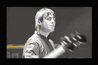 Man In Black Shirt Playing Guitar GIF