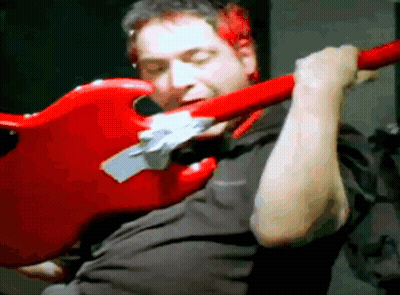 Man In Black Shirt Playing Red Electric Guitar GIF