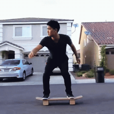 Man in Black Shirt Riding Skateboard