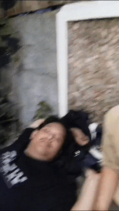 Man In Black Shirt Saying Army Lying On Floor GIF