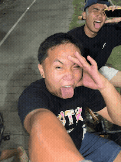 Man In Black Shirt Saying ATR Sticking Tongue Out GIF