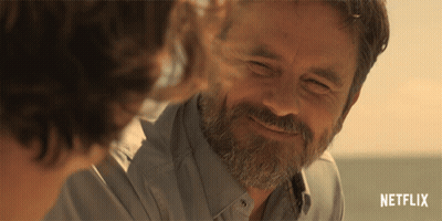 Man In Black Shirt Saying Black In Front Of Race Car GIF