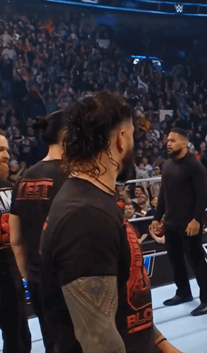 Man In Black Shirt Saying Block In Front Of Crowd GIF
