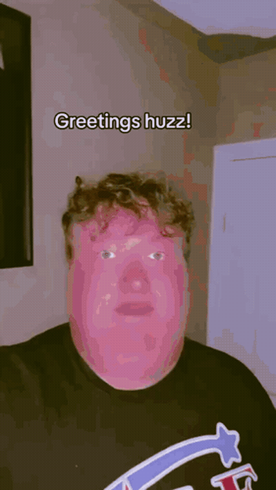 Man In Black Shirt Saying Greetings Huzz GIF