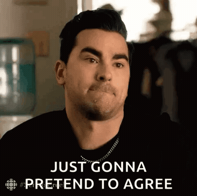 Man In Black Shirt Saying Just Gonna Pretend To Agree GIF
