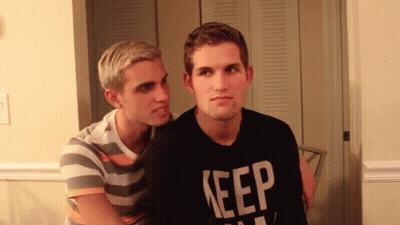 Man In Black Shirt Saying Keep Talks To Another Man GIF