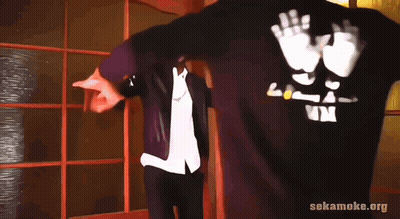 Man In Black Shirt Saying LP Next To Another Man GIF