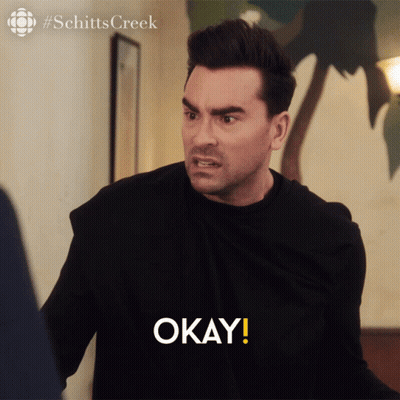 Man In Black Shirt Saying Okay Schitts Creek Logo GIF
