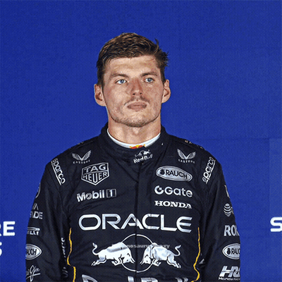 Man In Black Shirt Saying Oracle In Front Of Blue Wall GIF