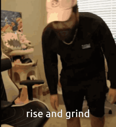 Man In Black Shirt Saying Rise And Grind GIF