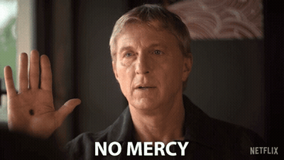 Man In Black Shirt Says No Mercy GIF