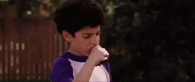 Man In Black Shirt Shaking Hands With Boy In Purple Shirt GIF