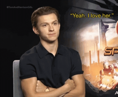 Man in Black Shirt Sitting Arms Crossed Saying Yeah I Love Her