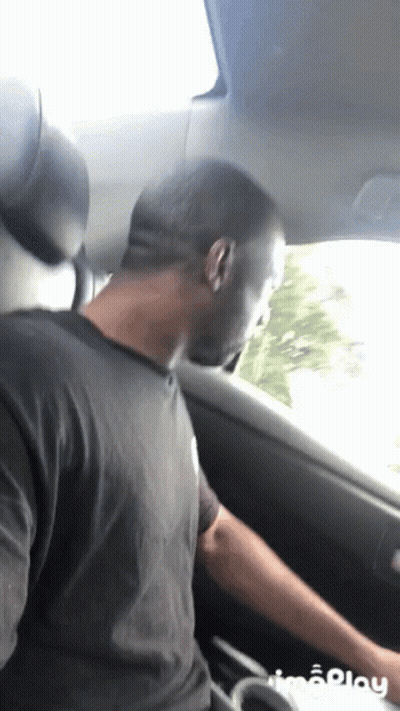 Man In Black Shirt Sitting In Car GIF