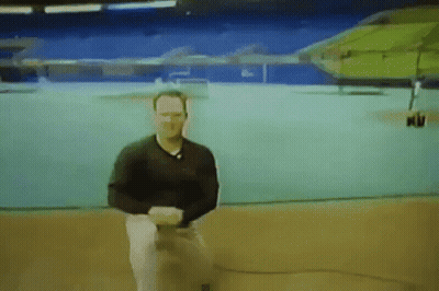 Man In Black Shirt Sitting In Front Of Screen Saying Nu GIF